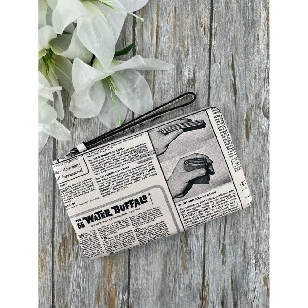 Coach Large Corner Zip Wristlet With Newspaper Print Pebbled Leather Bag
